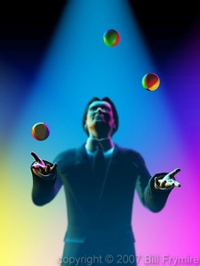 man-juggling-balls-yellow-blue-pink-background